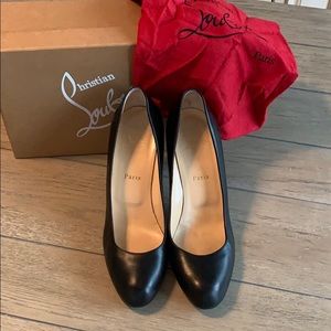 Christian Louboutin black leather pumps